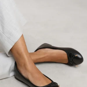 BEXLEY SLIP ON FLAT PUMPS IN BLACK FAUX LEATHER